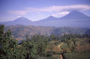 Cloud cap of lenticular clouds over the Virunga Mountains Volcanoes of Sabyinyo Gahinga Muhabura in northwest Rwanda Central Africa