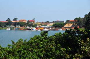 Entebbe, Wakiso District, Uganda: small marina on Lake Victoria - notice the train cars used as support installations, Manyago area - photo by M.Torres